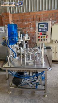 Envasadora dosadora seladora rotativa em inox com selo de alum�nio para potes, copos e frascos Delgo
